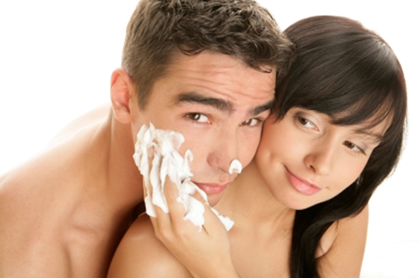 Woman Puting Shaving Cream on Man's Face